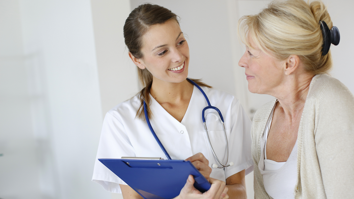 nurse practitioner talking to a patient