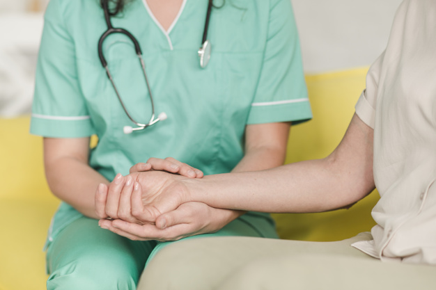 nurse checking pulse mobile phlebotomist