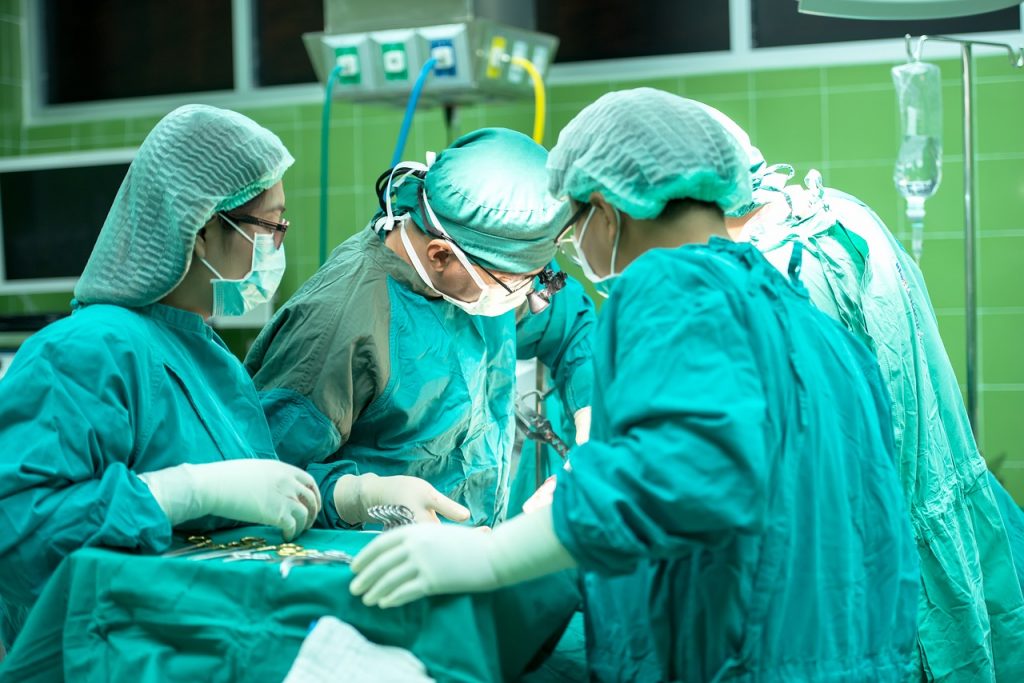 doctors and assistant nurses doing surgery